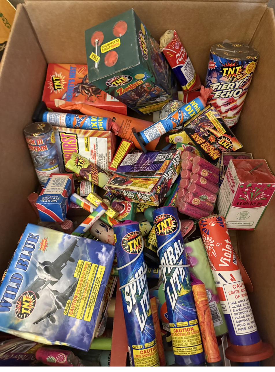 A real box of novelty fireworks — snakes, poppers, smoke, ground blooms